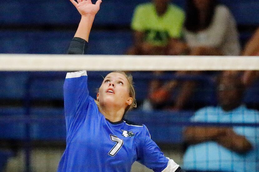 Plano West outside hitter Jill Pressly (7) makes a hit in game two as Plano West High School...