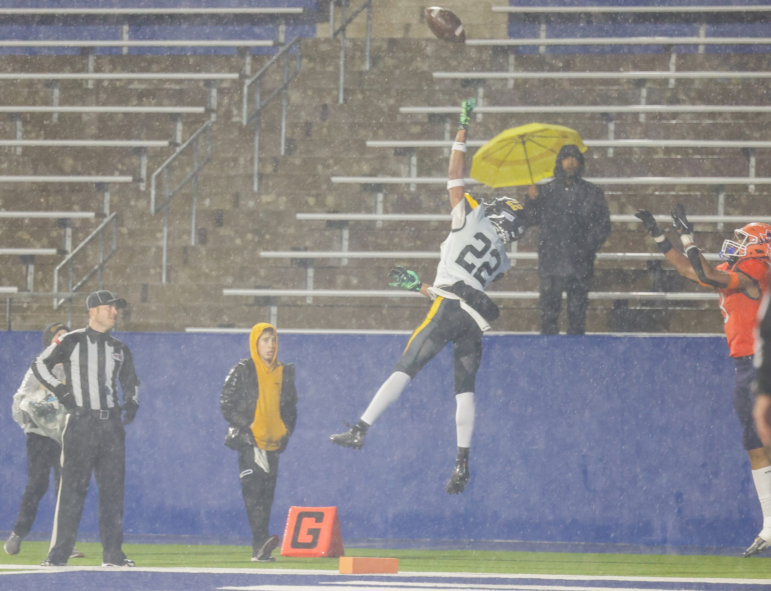 Forney defensive back Joshua Gatlin (22) and McKinney North wide receiver Kameron Powell (3)...