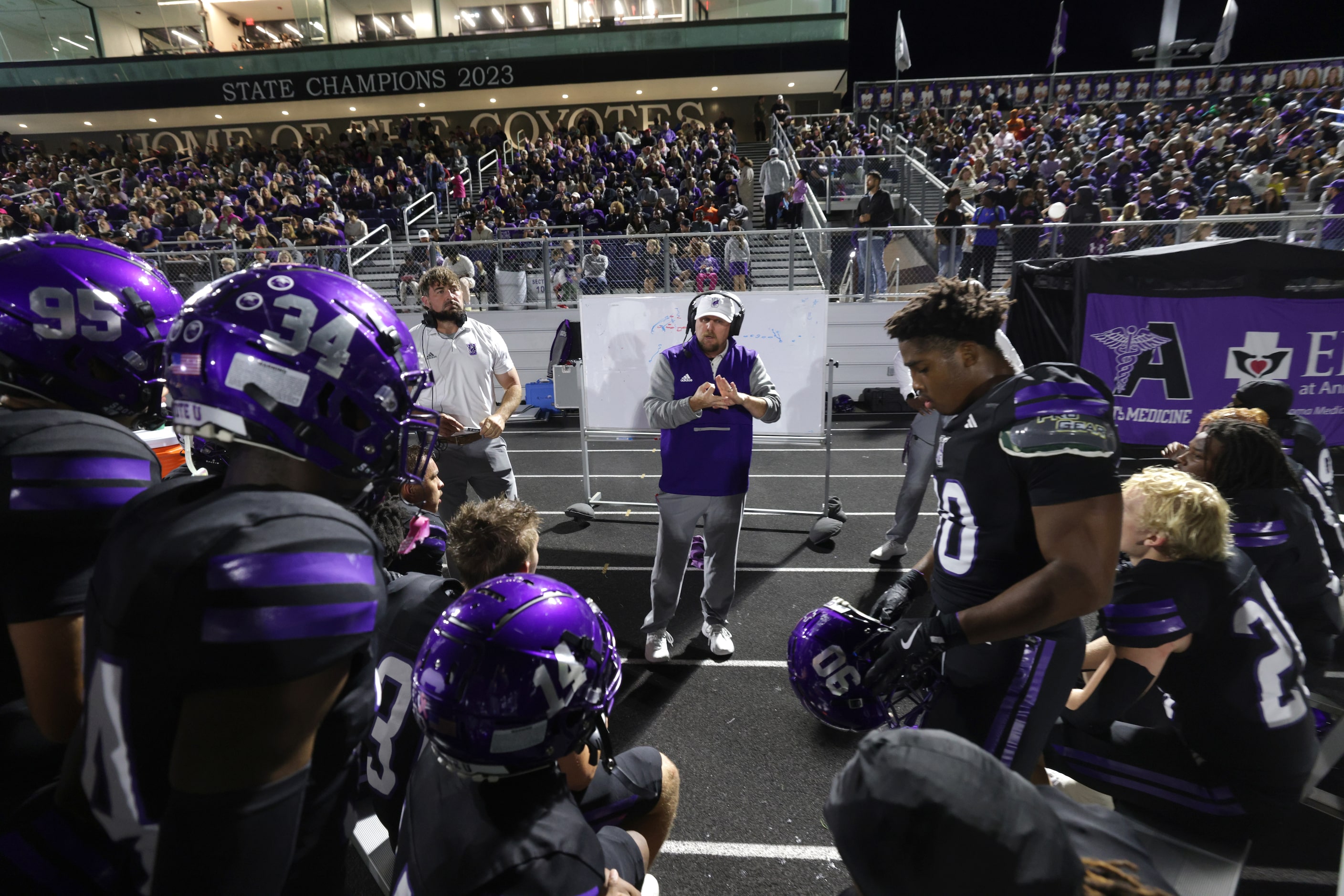 The Anna team discusses their gameplan during the Prosper Walnut Grove High School versus...