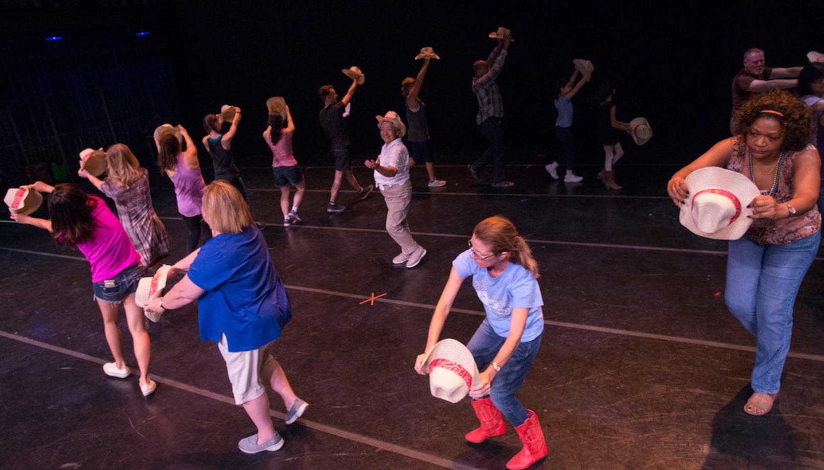 Performers rehearse a number from Bolero Texas, a piece choreographed by Larry Keigwin as...