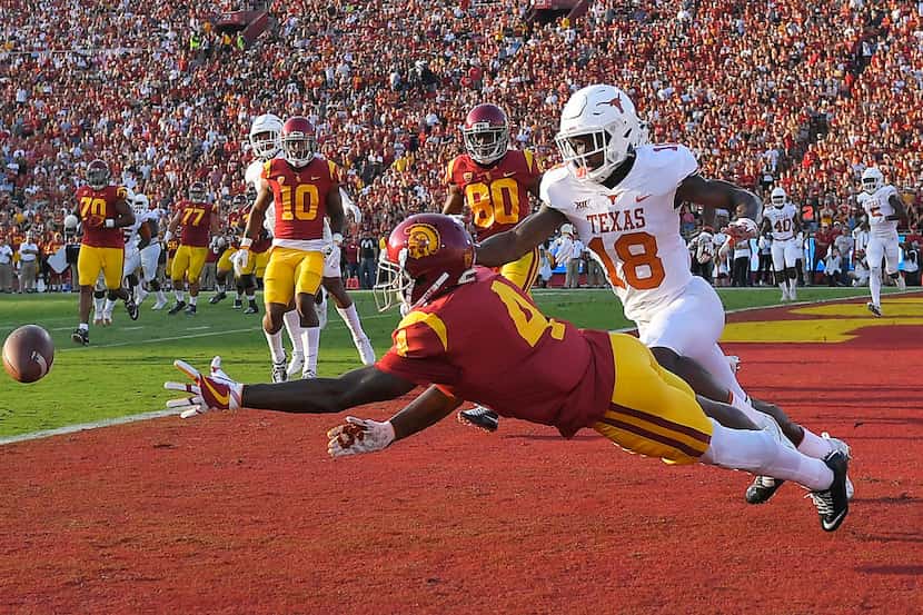 Southern California wide receiver Steven Mitchell Jr. left, can't reach a pass intended for...