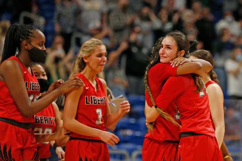 Frisco Liberty Maya Jain #24 hugs Frisco Liberty Jazzy Owens-Barnett #30 at the end of the...