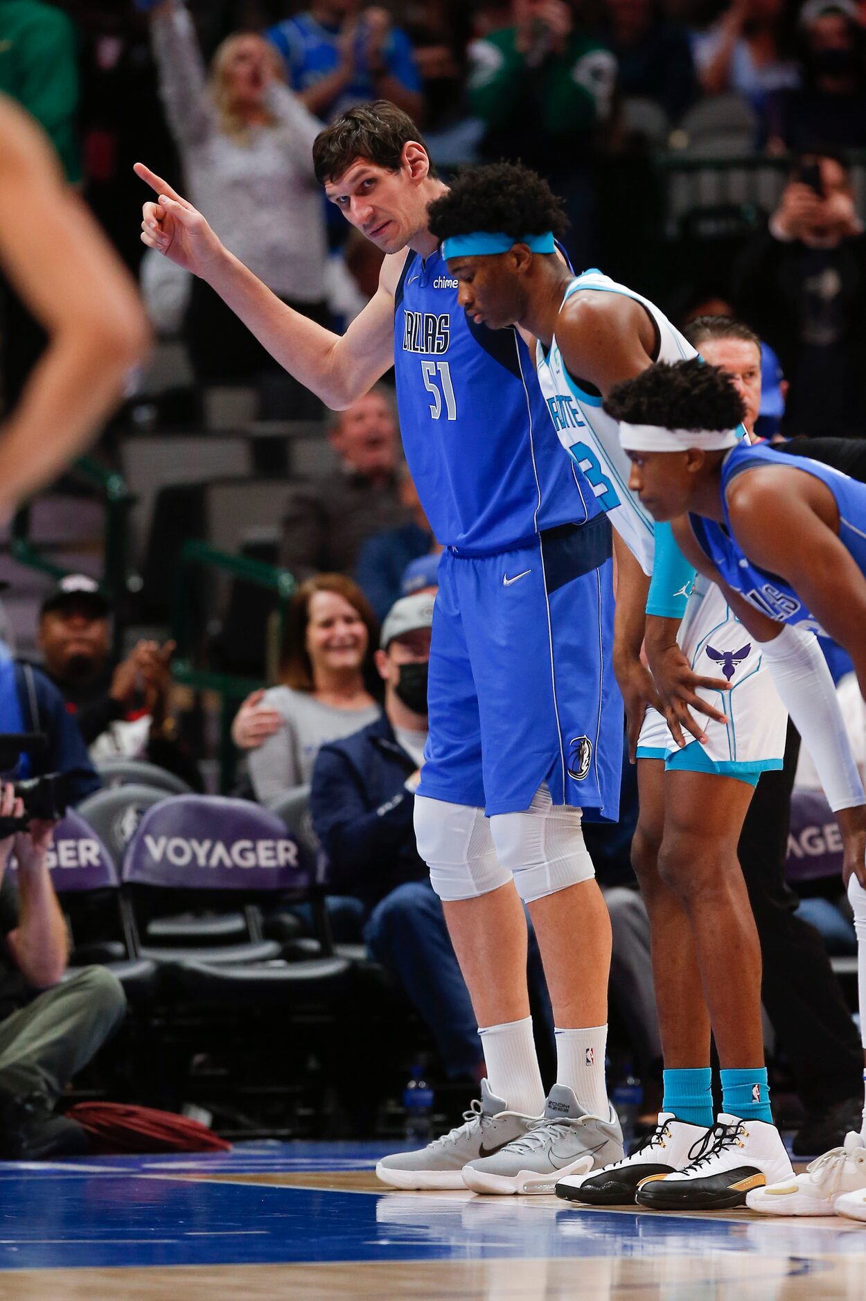 Dallas Mavericks center Boban Marjanovic (51) acknowledges fans after checking into the game...