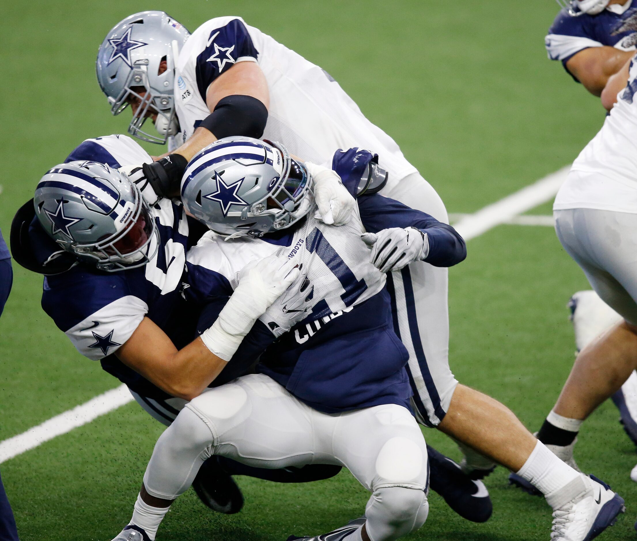 Dallas Cowboys guard Zack Martin (70) attempts to stop Dallas Cowboys linebacker Leighton...