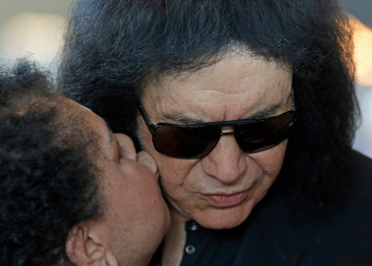 Gene Simmons (right) gets a kiss from fan Cynthia Fields-Jalil at Rock & Brews in The...