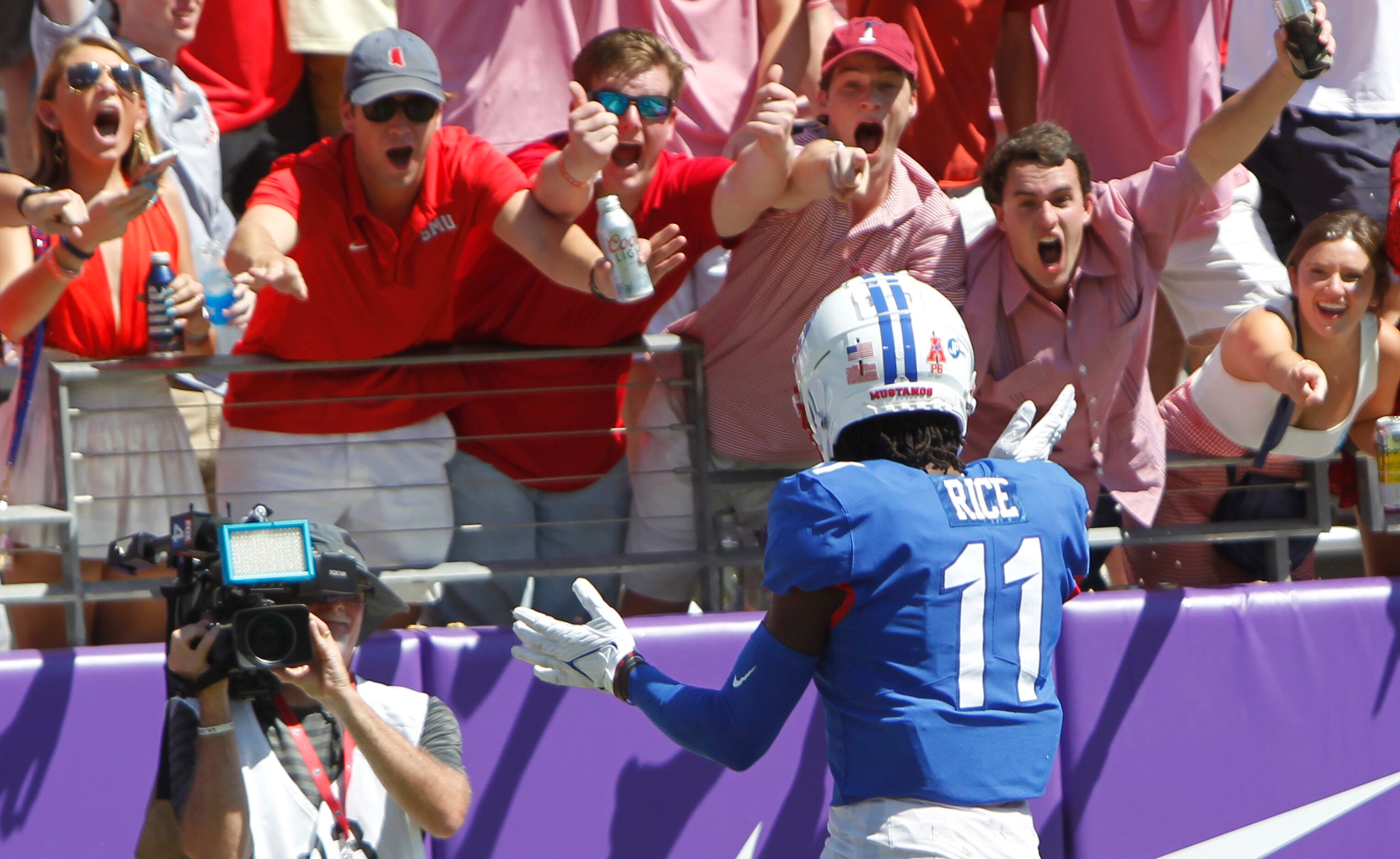 SMU receiver Rashee Rice (11) celebrates with Mustangs fans in the end zone following his...