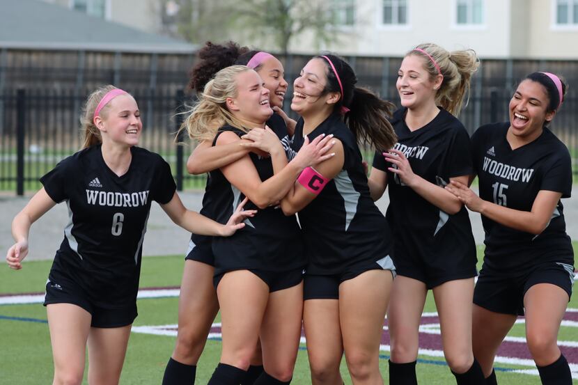 Woodrow Wilson girls soccer players celebrate during a bi-district playoff game against...