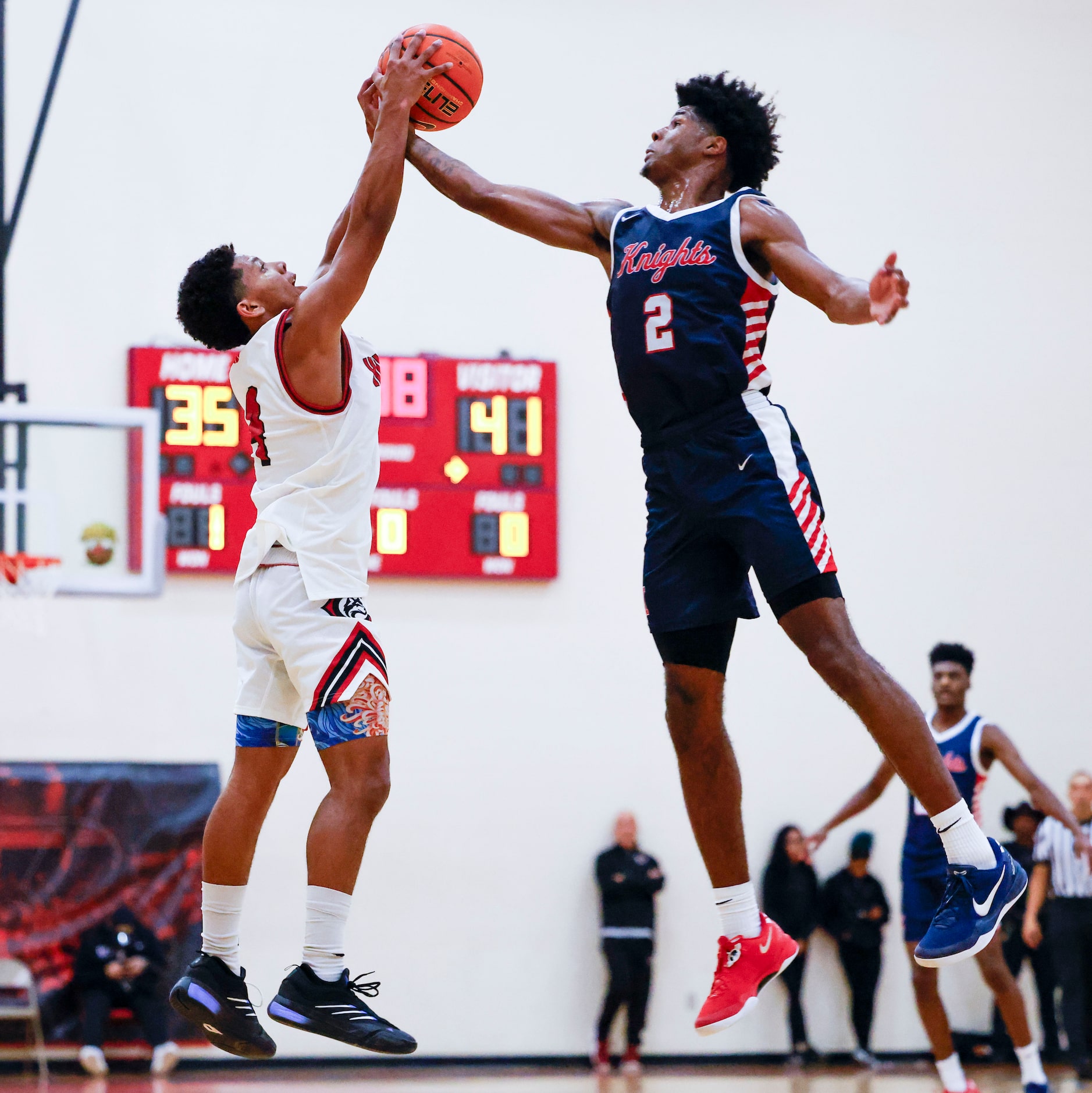 Kimball High’s Jaylon Dean-Vines (2) fights for possession against CJ Richardson of...