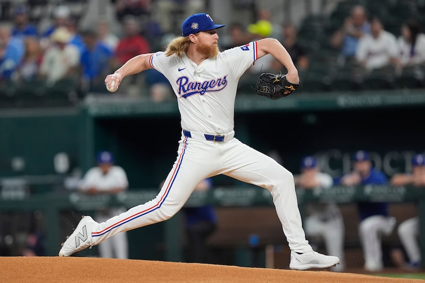 Texas Rangers pitcher Jon Gray throws during the first inning of a baseball game against the...