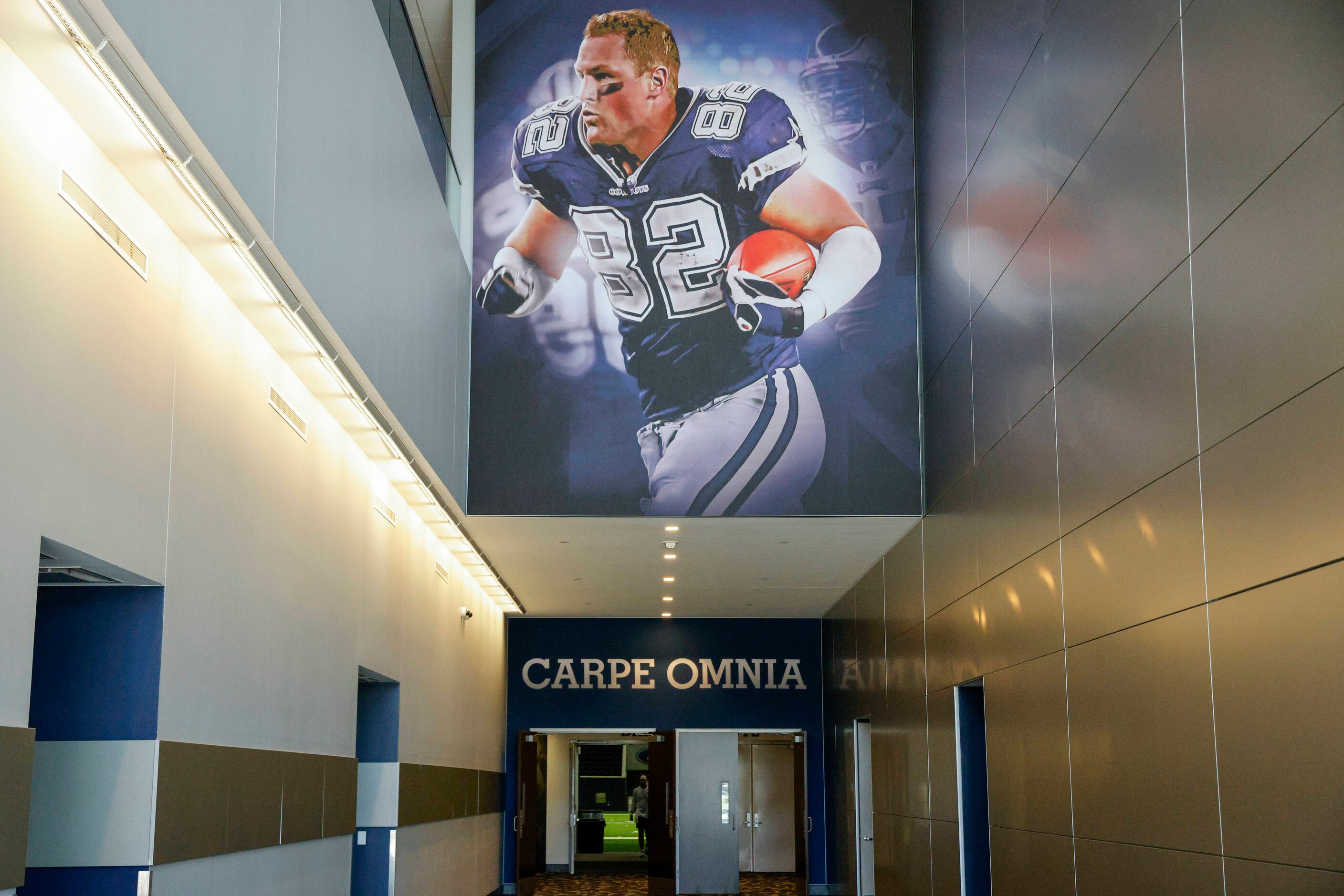 “Carpe Omnia” is seen above an entrance to The Ford Center and below a photo of former tight...