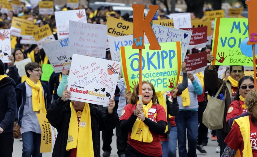 Students, teachers and supporters march on the grounds of the Texas Capitol, Friday, Jan....