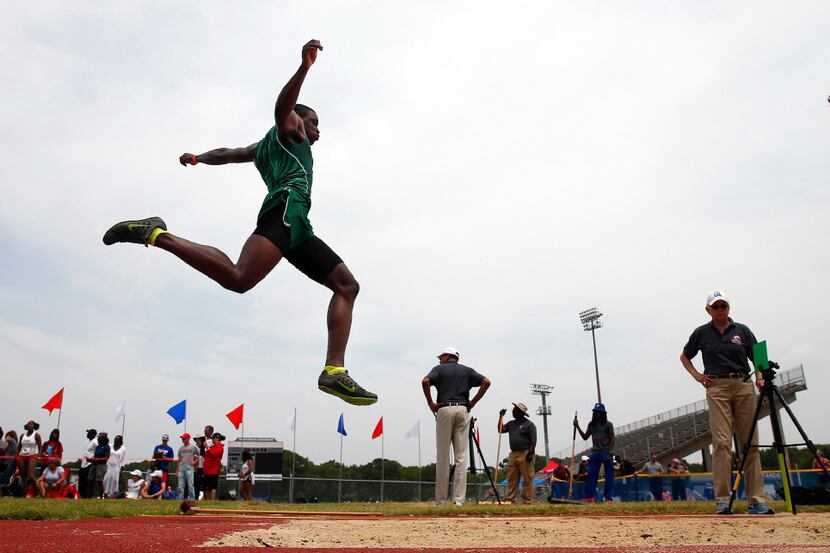 Waxahachie long jumper Jalen Reagor competes in the preliminary round of the 5A Region II...