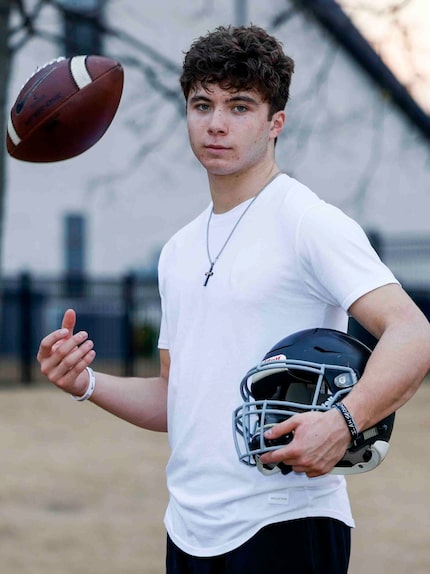 Rock Hill high school football player Kevin Sperry Jr. poses for a portrait outside of their...