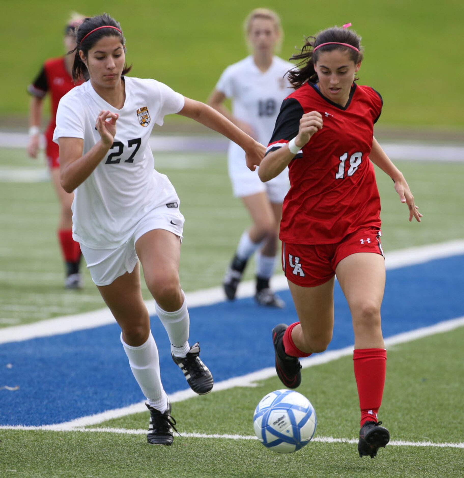 Ursuline Academys Peyton Robertson (18) and St. Agnes Academys Maddie Van Brunt (27) race...