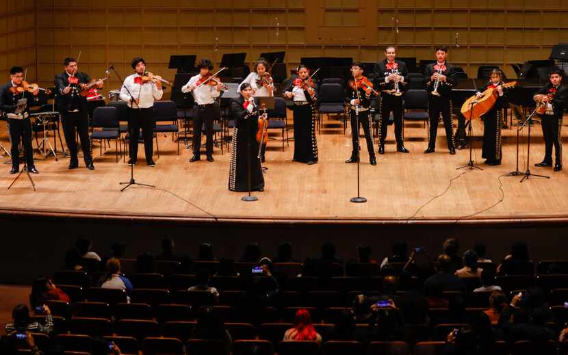 Members of Young Strings Alumni Mariachi close a joint concert between the Young Strings and...