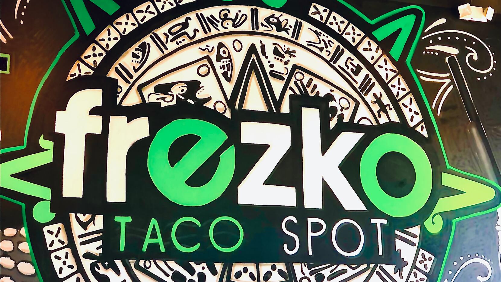 Fort Worth artist Juan Velazquez has painted several murals inside the new Frezko Taco Spot...