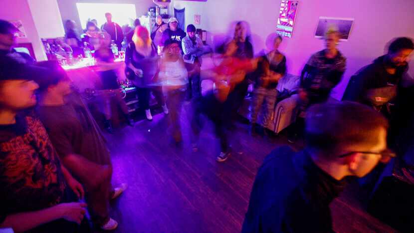 A long exposure shows people moshing as Bog performs during a house show on Friday, March...