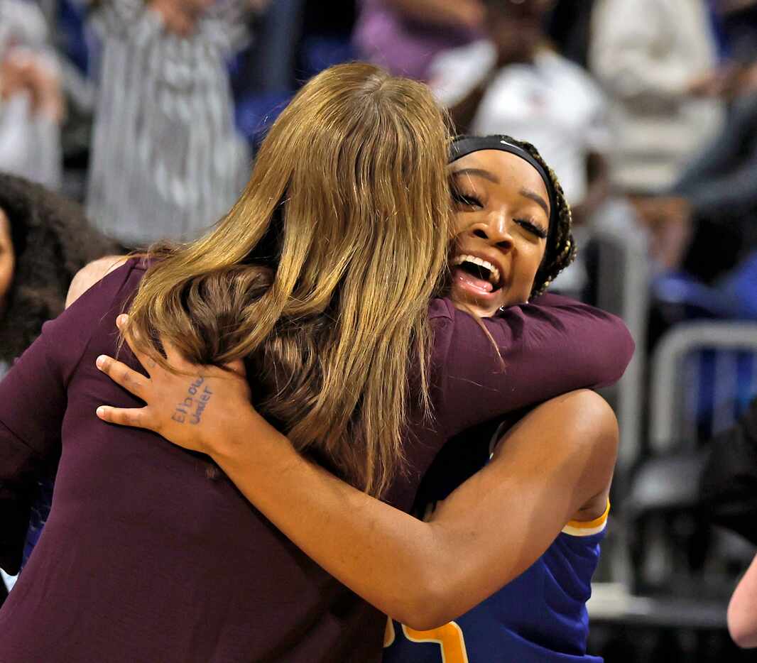 Sunnyvale Micah Russell (25) celebrates with Sunnyvale head coach Jill McDill as Sunnyvale...