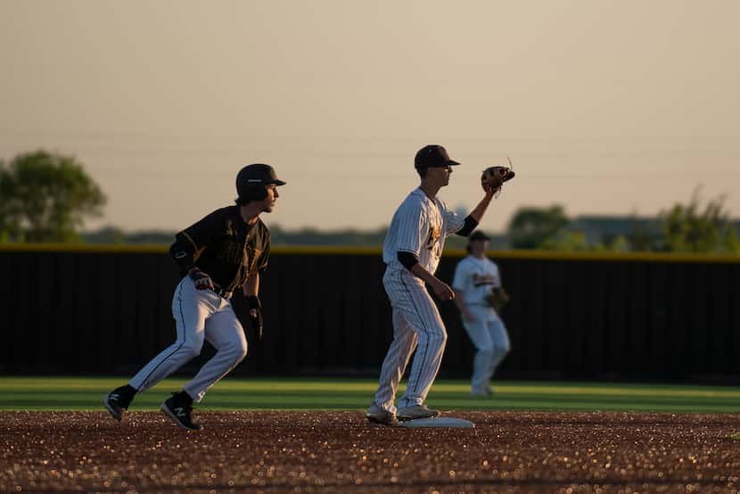 Forney second baseman Garret Hendricks (22) rounds second after a teammate gets a hit during...