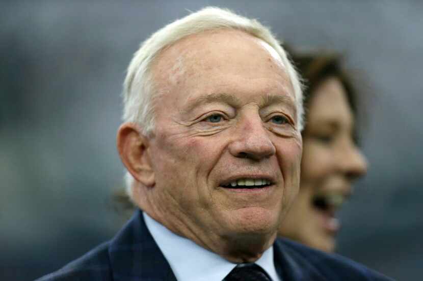 Dallas Cowboys team owner Jerry Jones stands on the field before an NFL football game...
