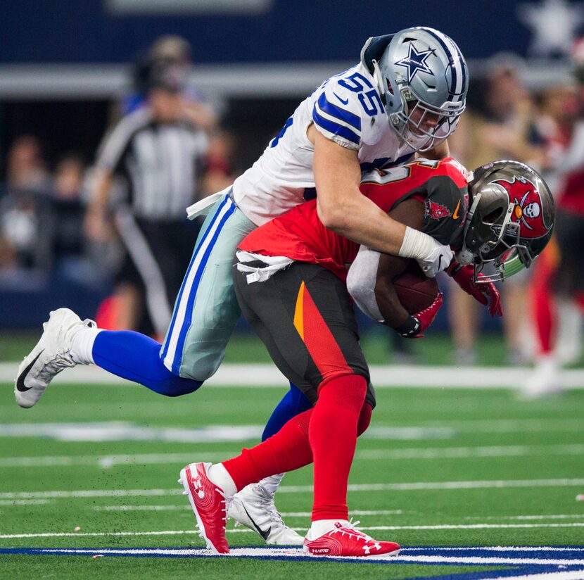 Dallas Cowboys outside linebacker Leighton Vander Esch (55) tackles Tampa Bay Buccaneers...