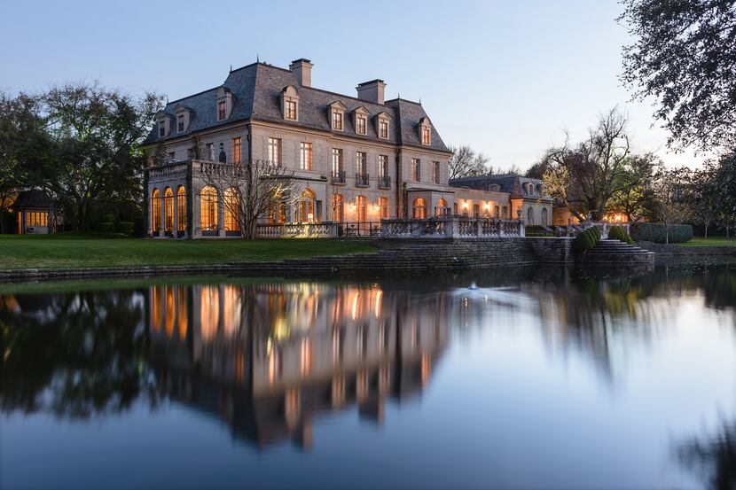 The 3.2-acre Haas estate on Jourdan Way includes a private lake.