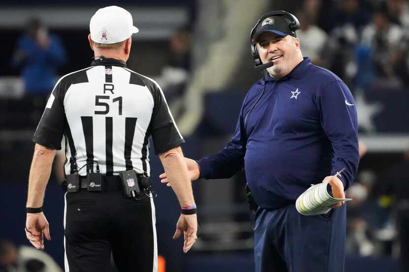 Dallas Cowboys head coach Mike McCarthy questions a call during the first quarter of an NFL...