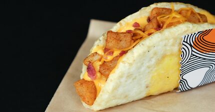 The Naked Egg Taco wraps potatoes, bacon or sausage and cheese into a fried egg shell.