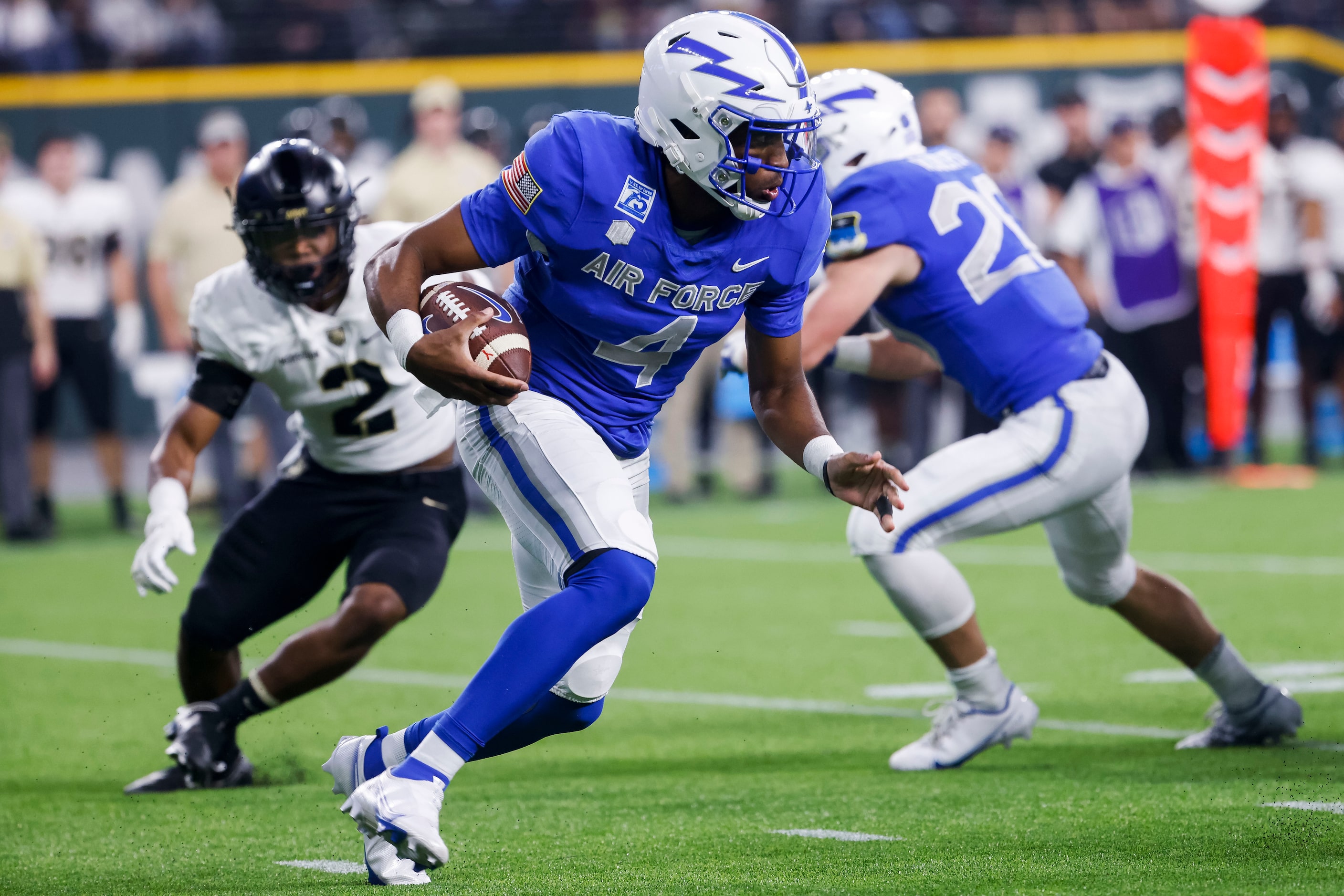 Air Force Falcons quarterback Haaziq Daniels (4) runs the ball during the second quarter of...