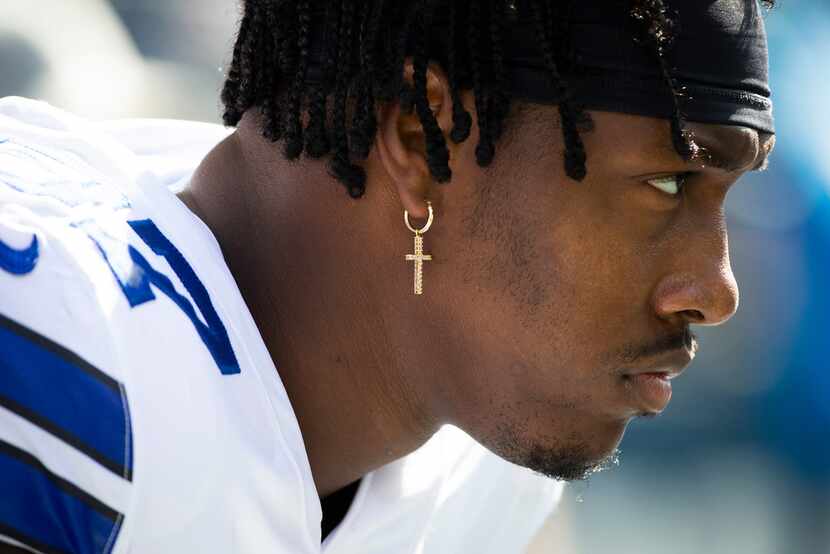 Dallas Cowboys defensive end Taco Charlton  watches from the bench before an NFL football...
