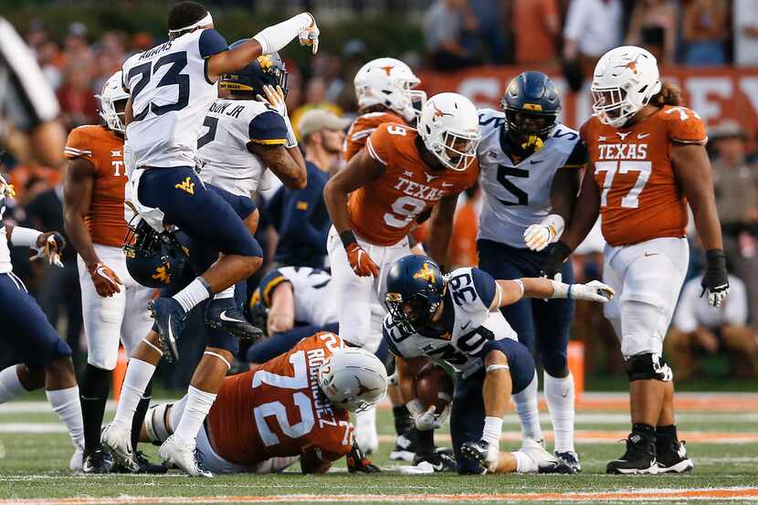 AUSTIN, TX - NOVEMBER 03:  Dante Bonamico #39 of the West Virginia Mountaineers recovers a...