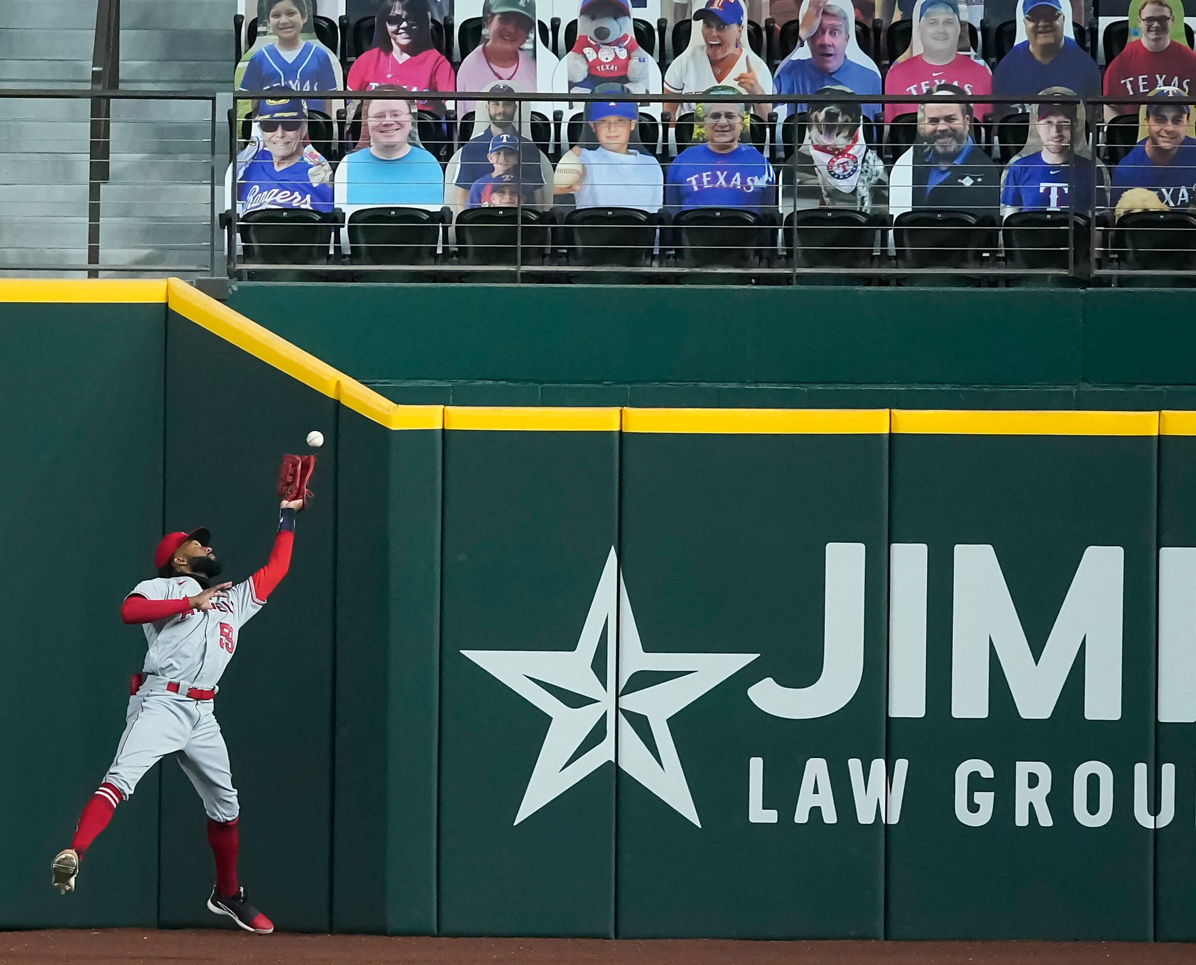 SEQUENCE ONE-OF-FOUR: Los Angeles Angels right fielder Jo Adell has the ball go off his...