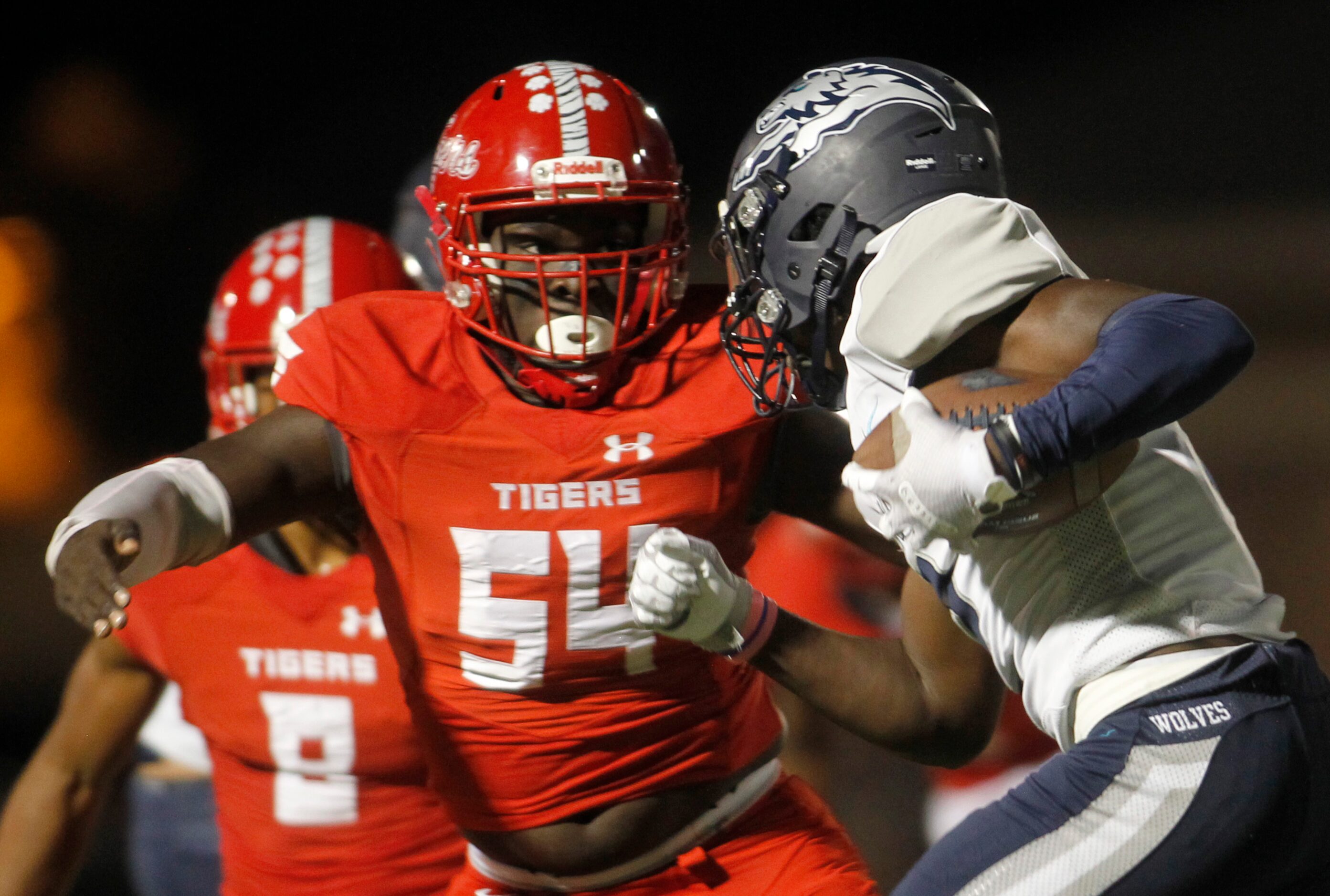 Terrell defender Jalen Hobbs (54) pursues Carrollton Ranchview running back Kenndy Mokom (2)...