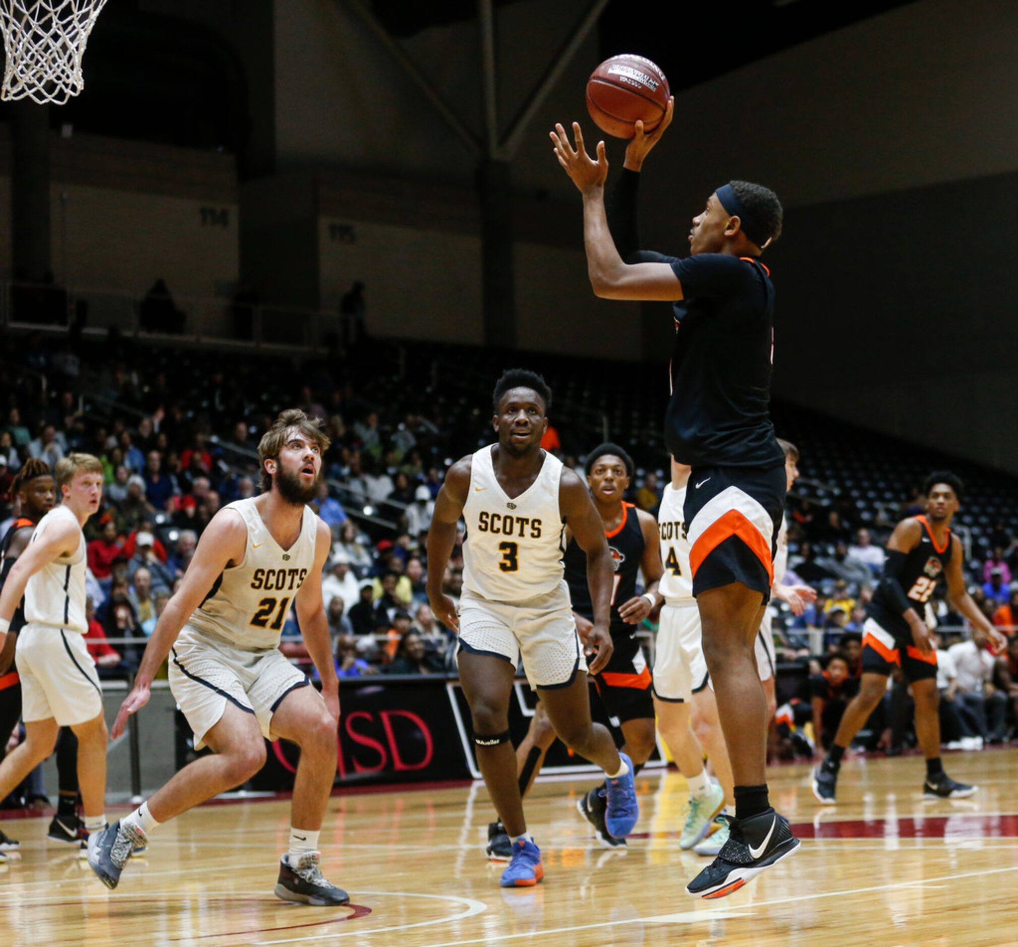 Lancaster's Markeis Sykes (3) puts up a shot during the first half of a boys basketball UIL...