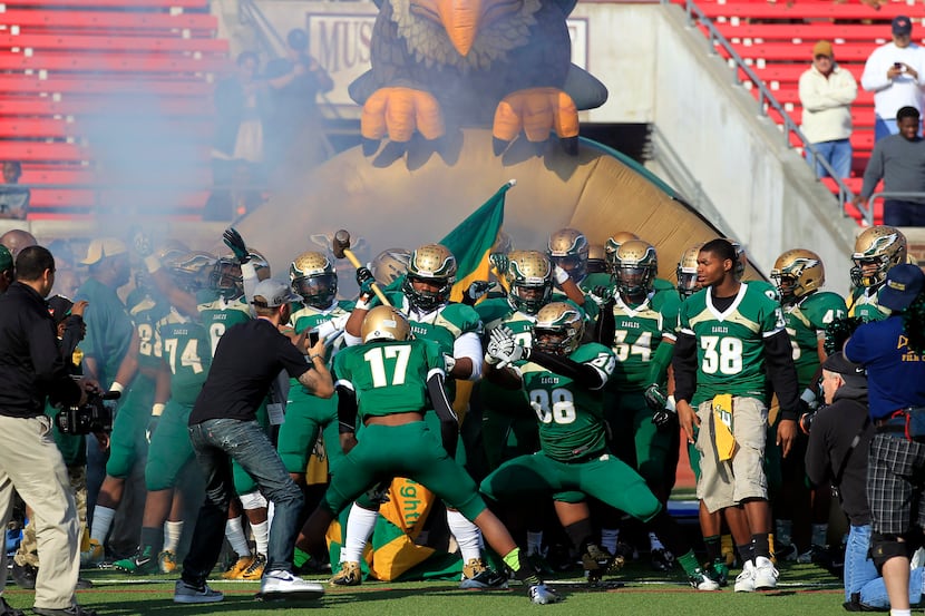 The DeSoto Eagles prepare to enter the field before the start of a UIL high school Class 5A...