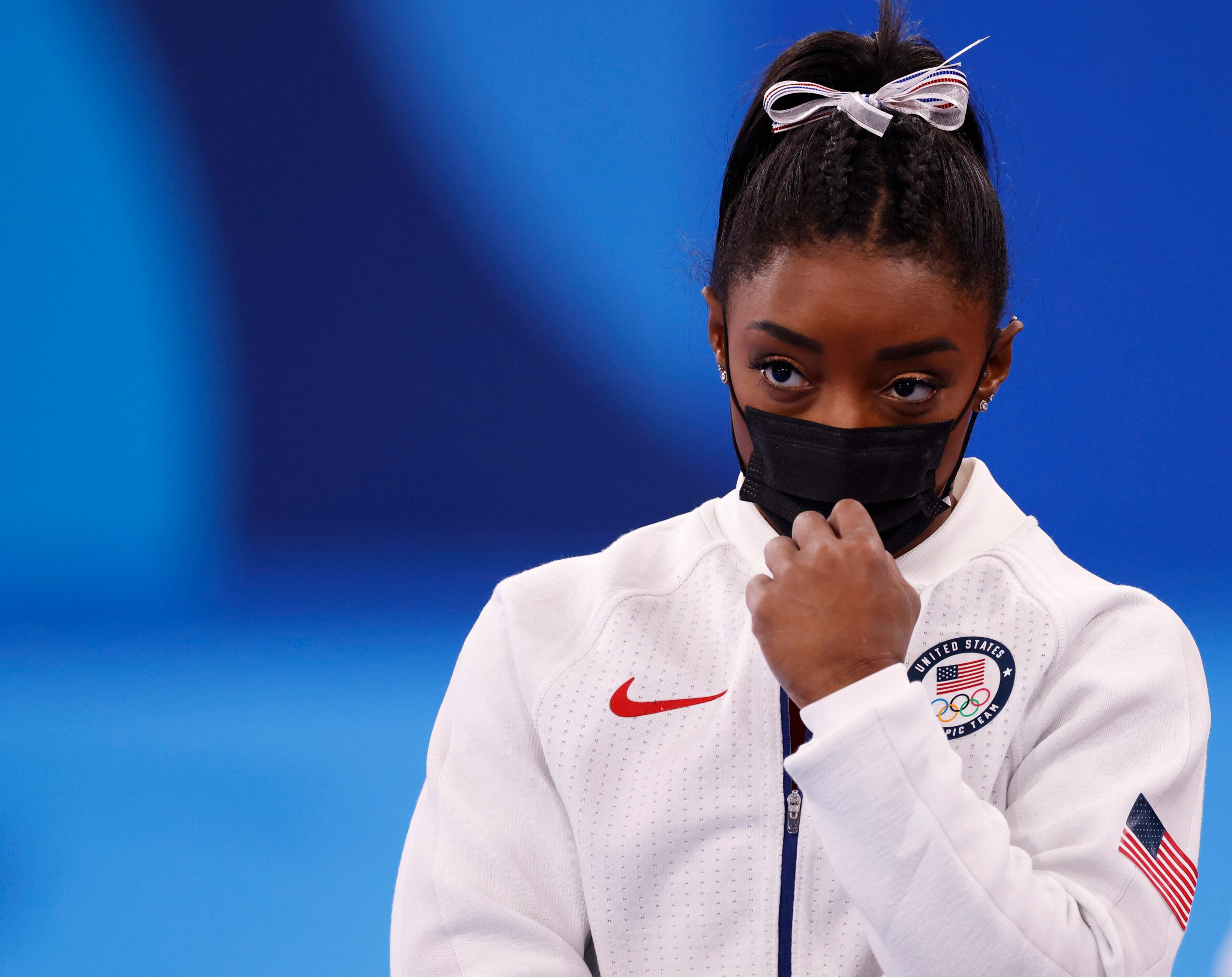 USA’s Simone Biles watches after pulling out of the competition after the vault event during...