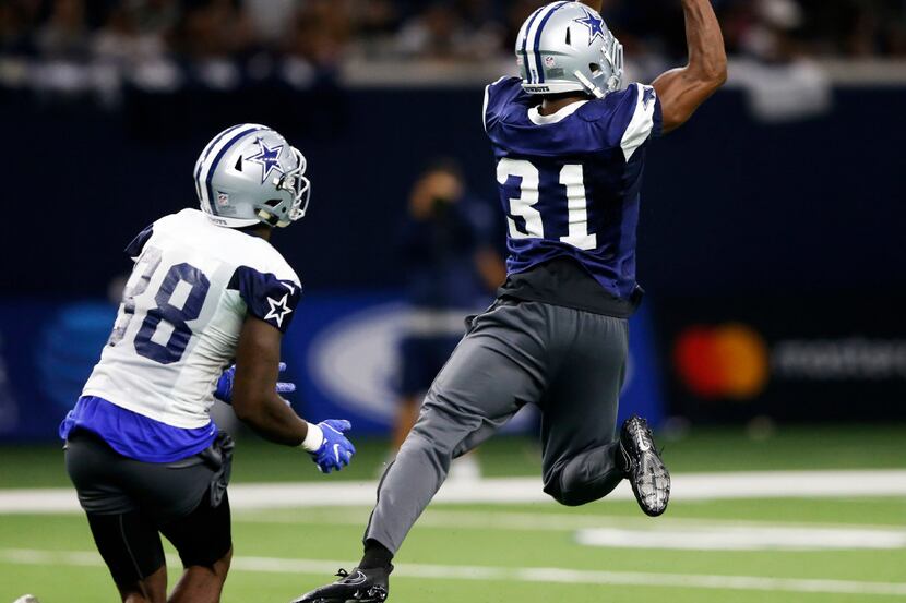 Dallas Cowboys free safety Byron Jones (31) intercepts a pass in front of Dallas Cowboys...