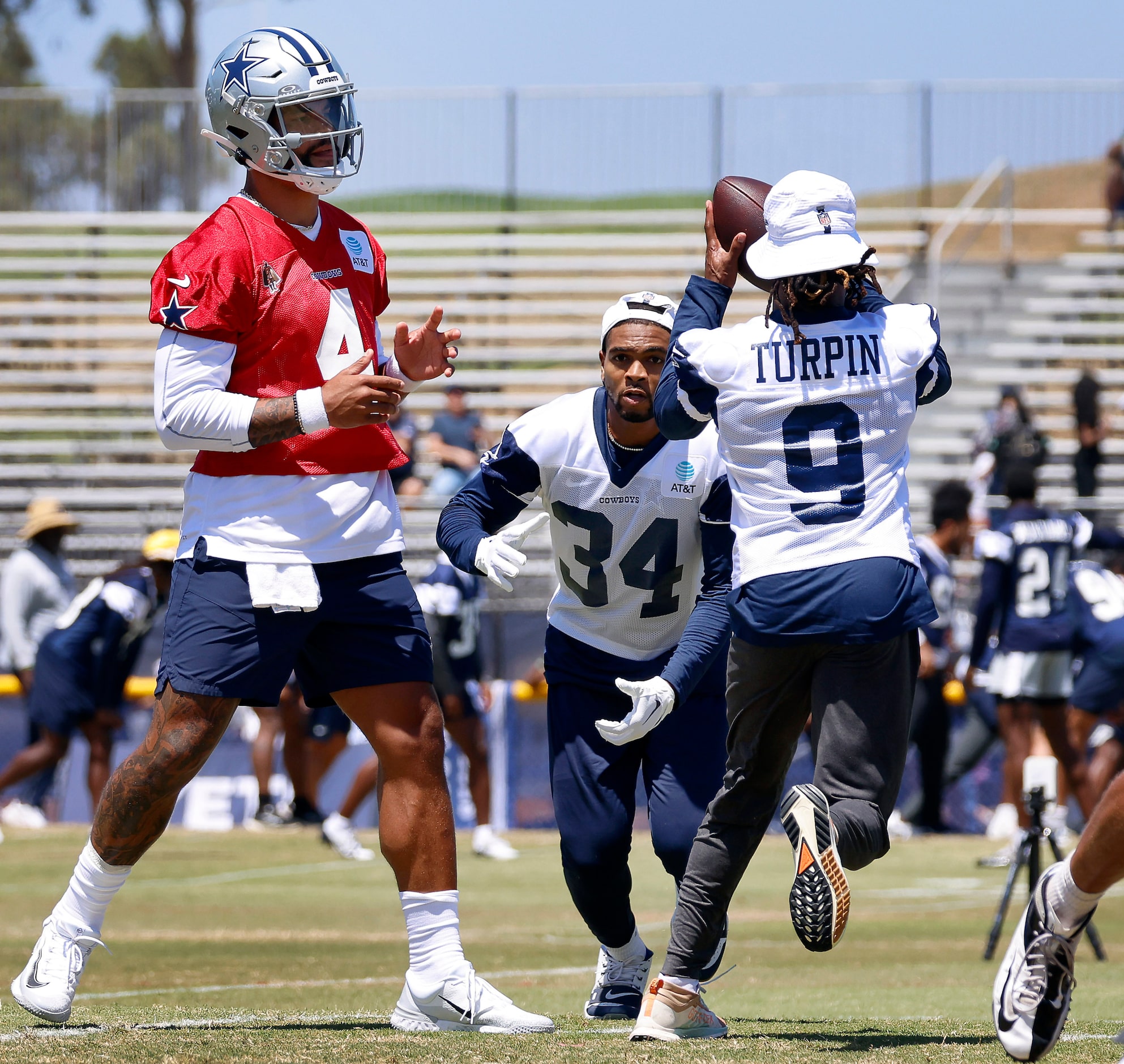 Dallas Cowboys quarterback Dak Prescott (4) flips the ball to wide receiver KaVontae Turpin...