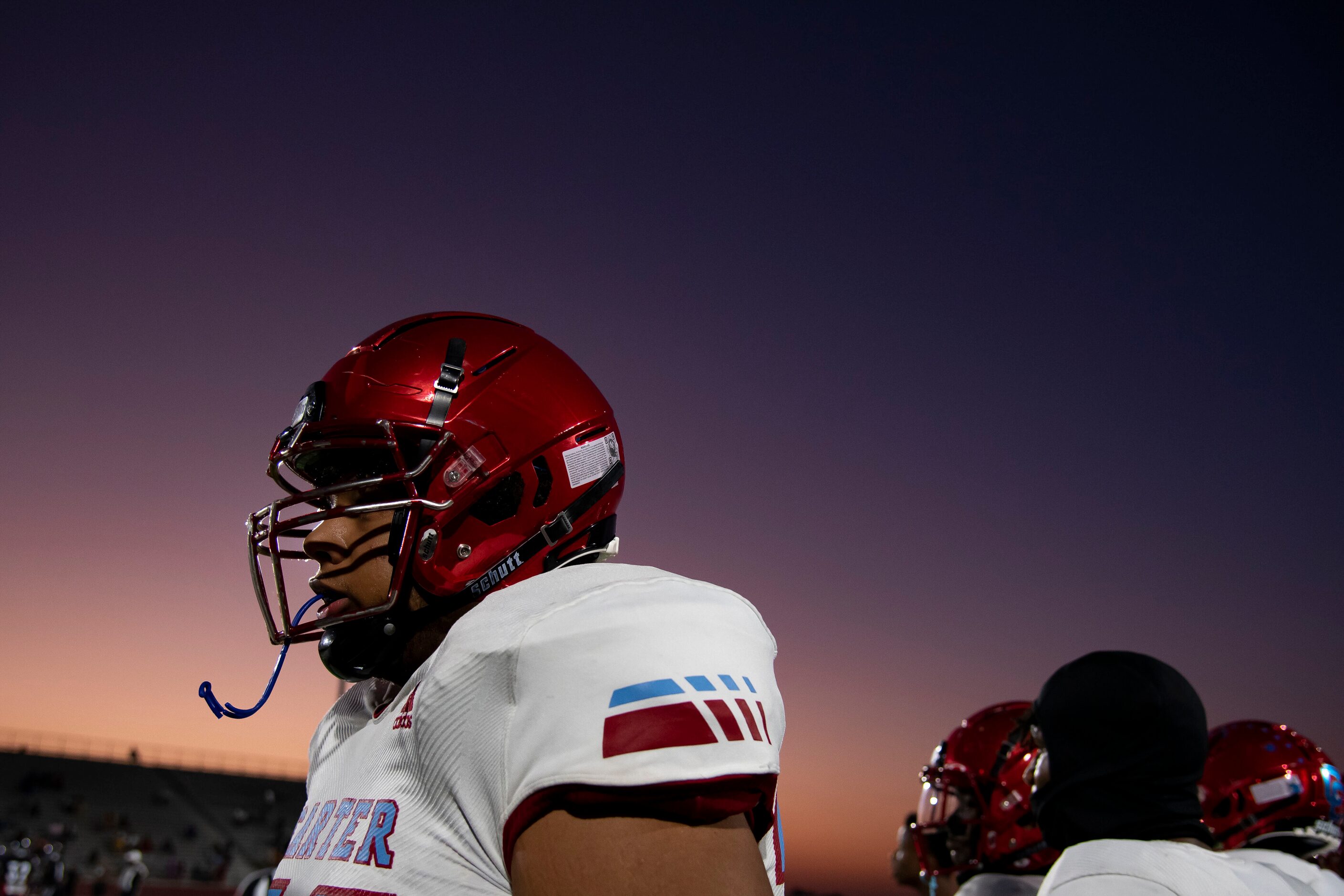 Carter senior Kourtney Ellis (72) walks down the sideline after a play during a high school...