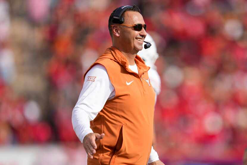 Texas head coach Steve Sarkisian stands on the field after a touchdown by his team during...