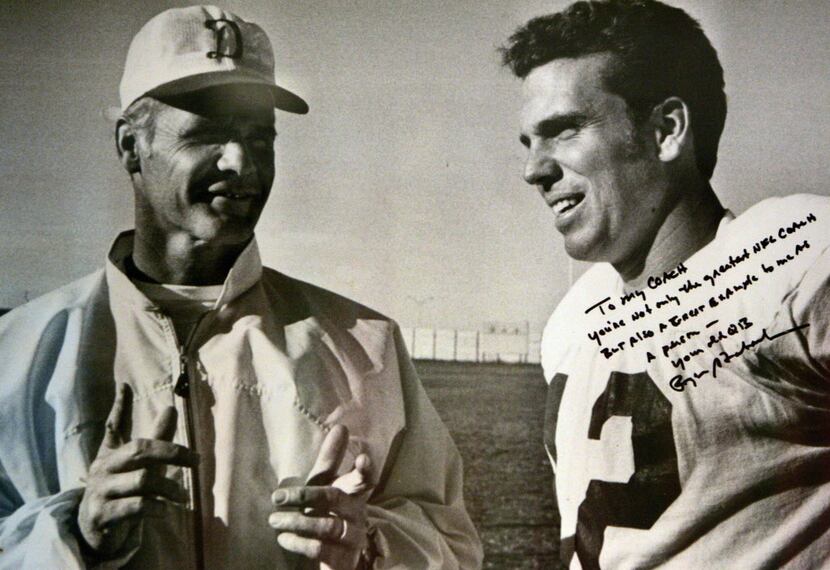 A photograph of (L-R) legendary Dallas Cowboys coach Tom Landry and quarterback Roger...