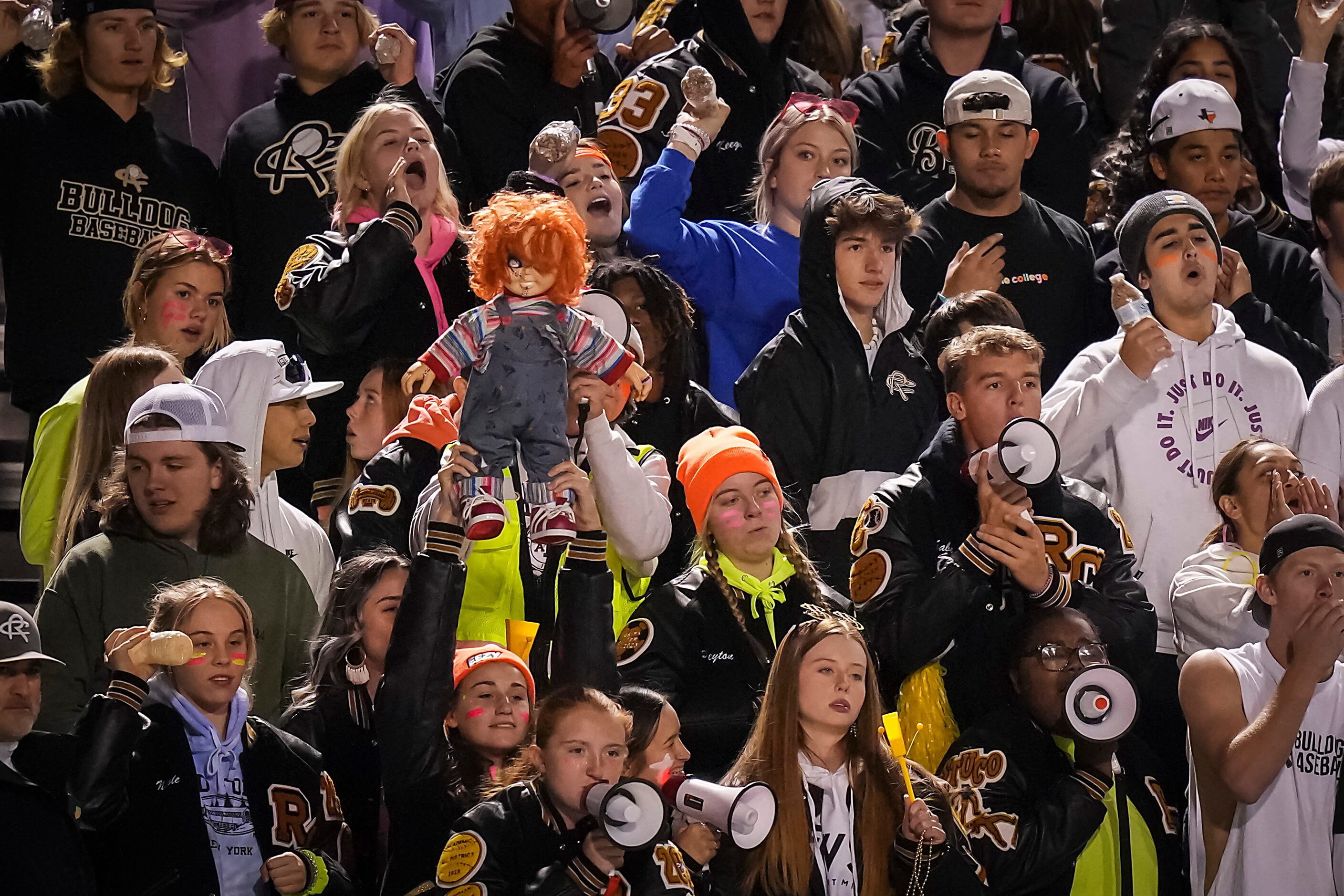 Fans in the Royce City student section cheer their team during the second quarter of a...