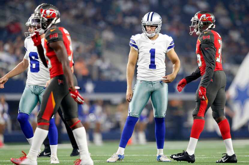 Dallas Cowboys punter Kasey Redfern (1) reacts after missing an extra point during the first...