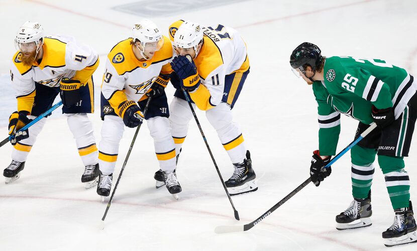 Nashville center Brian Boyle (11) whispers to teammate Calle Jarnkrok out of earshot of...