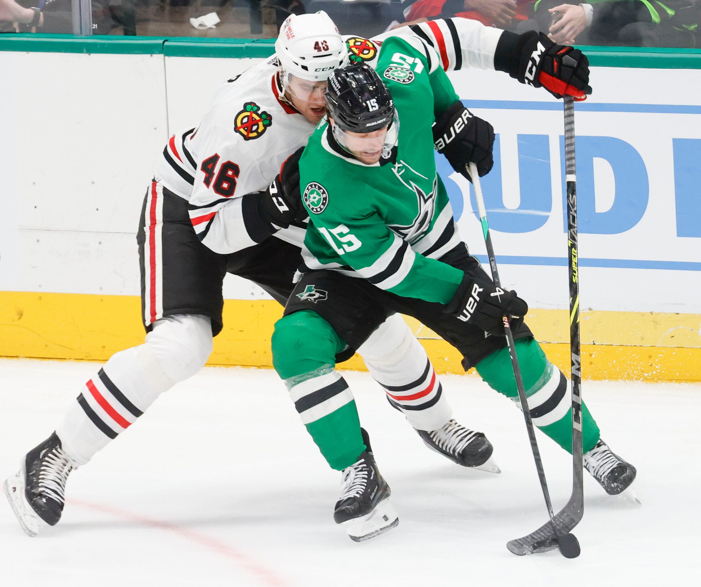 Chicago Blackhawks defensemen Louis Crevier (46) fights for the puck against Dallas Stars...