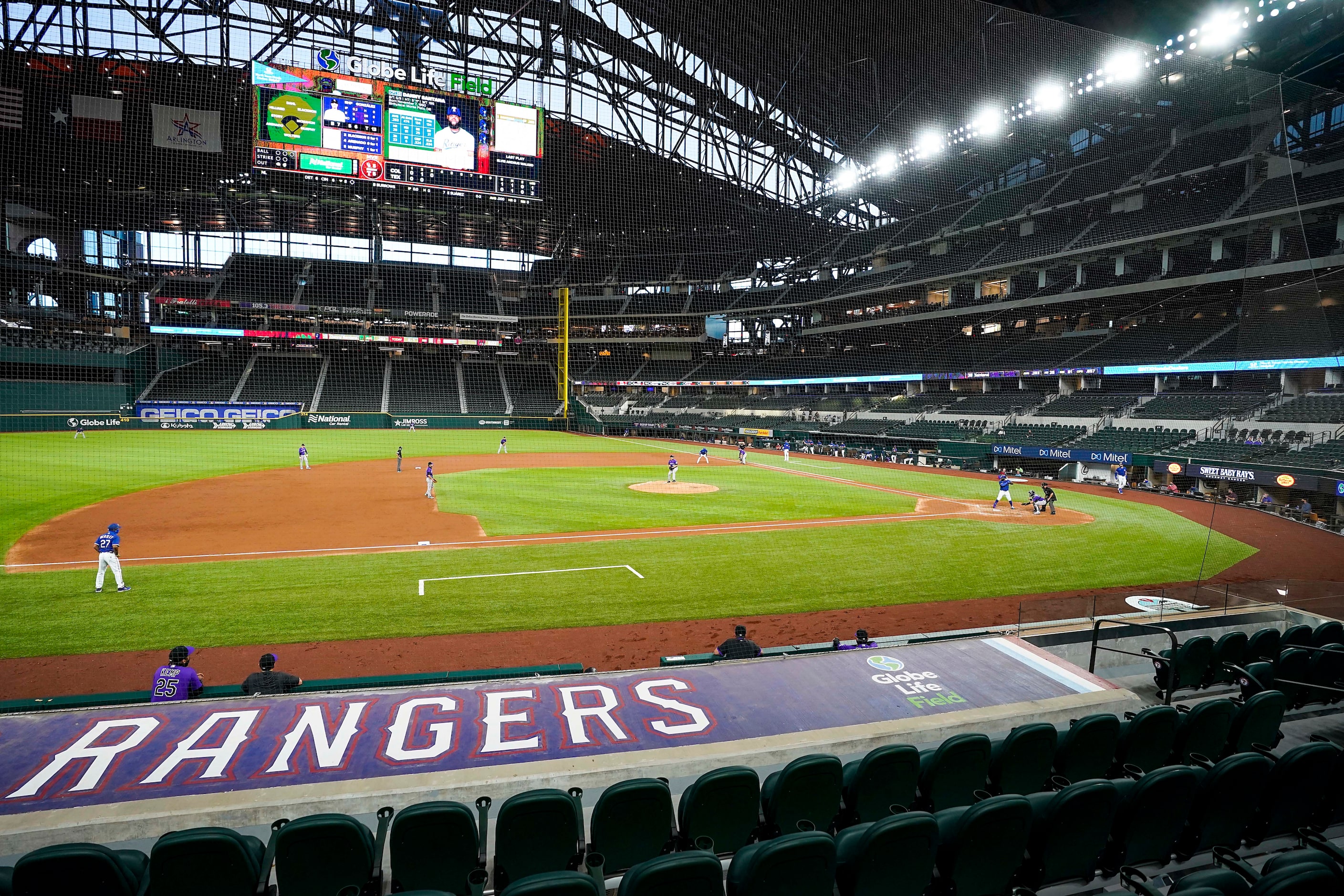 Texas Rangers outfielder Danny Santana bats during the second inning of an exhibition game...