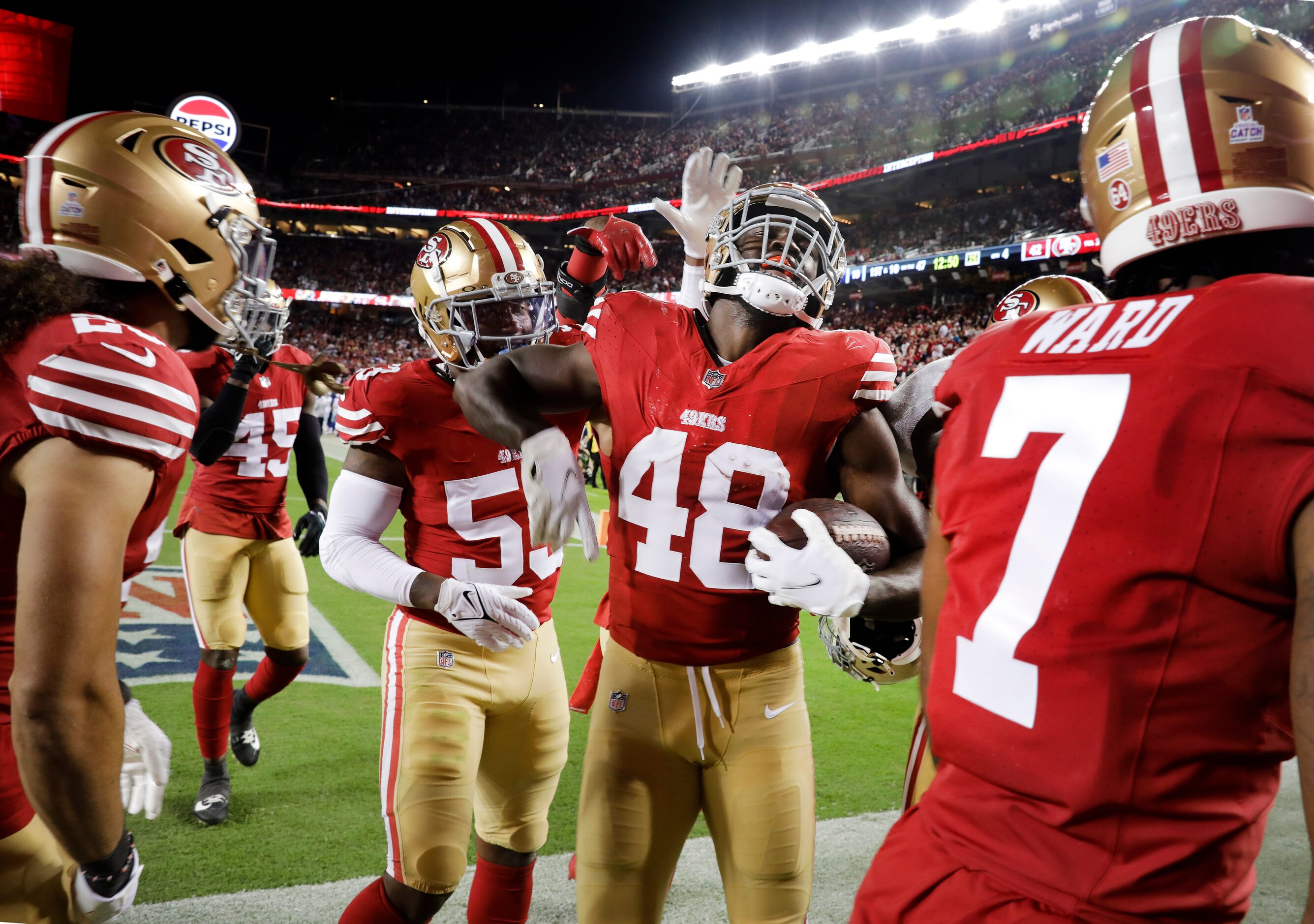 San Francisco 49ers linebacker Oren Burks (48) celebrates his second half interception of...