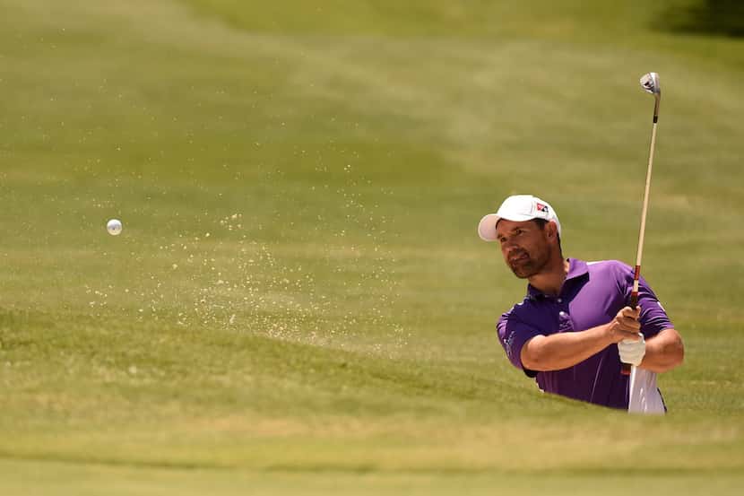 Padraig Harrington hits from a sand trap on the 9th hole during the final round of the HP...