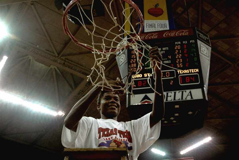 FILE - Sheryl Swoopes of Texas Tech cuts down the net after leading her team to victory over...