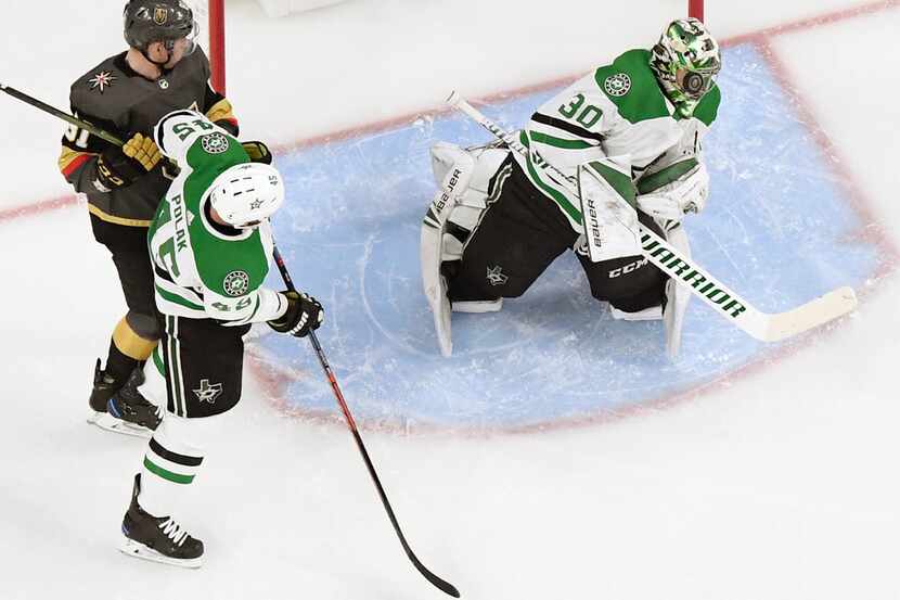 LAS VEGAS, NEVADA - FEBRUARY 26:  Ben Bishop #30 of the Dallas Stars blocks a shot as...